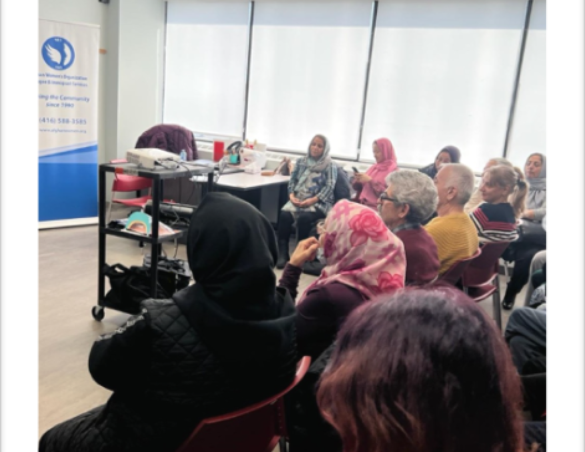 Participants listening during a community education session