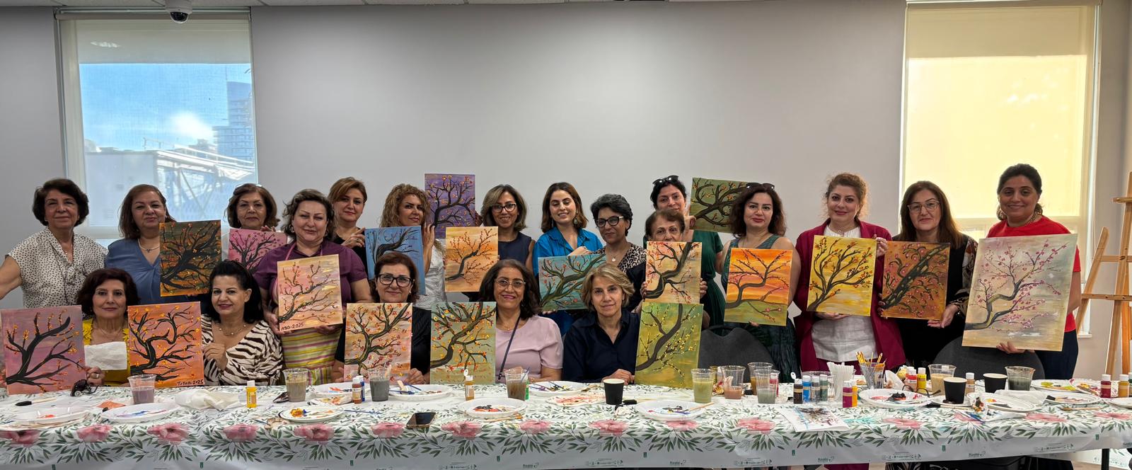 Community members displaying artwork created together