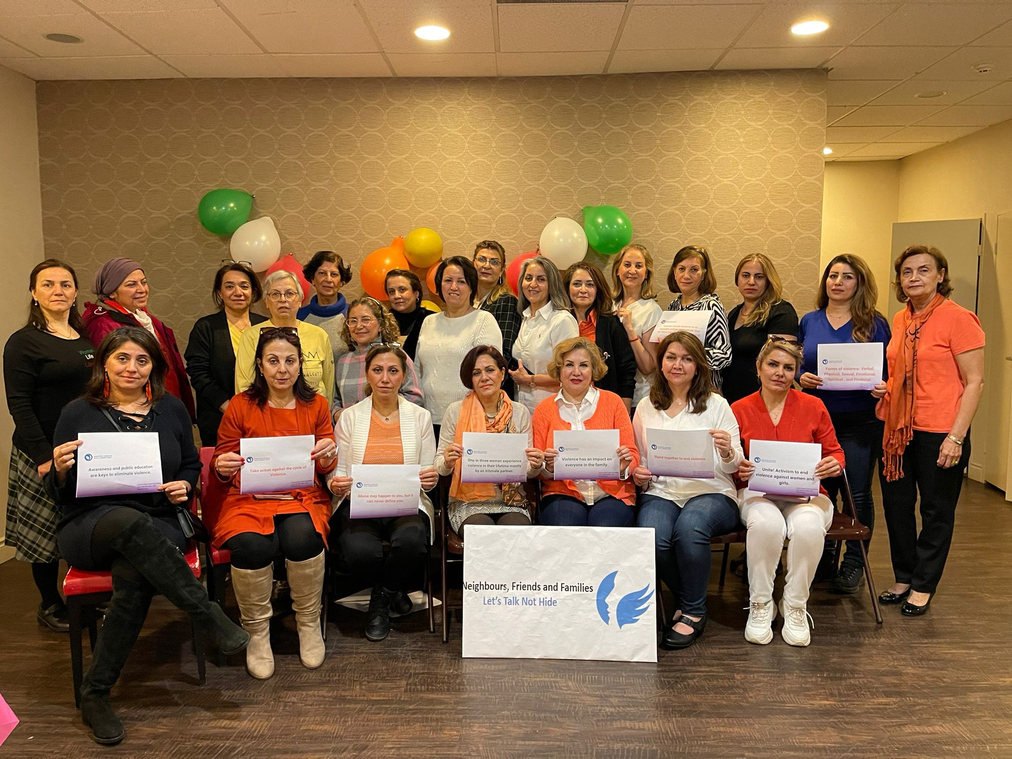 Community participants supporting a gender-based violence awareness campaign