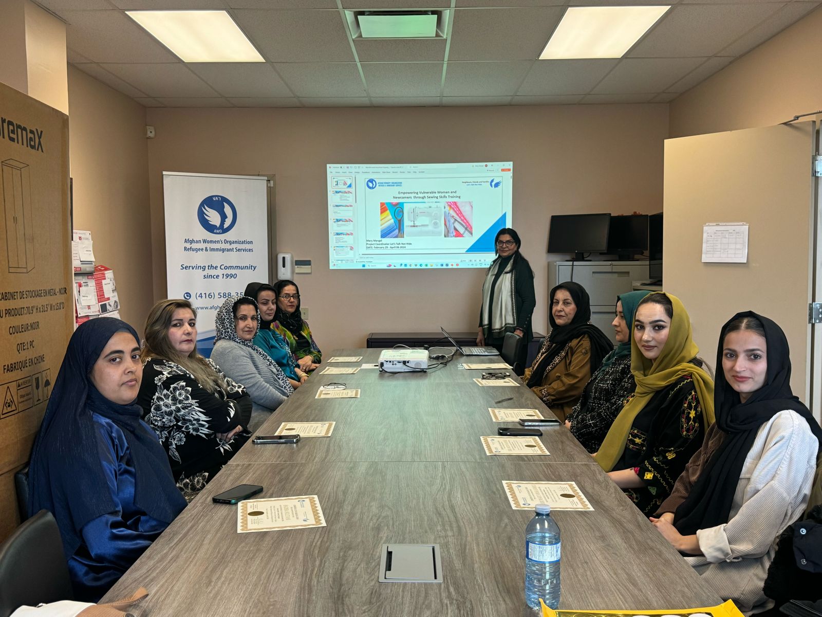 Women participating in sewing skills training